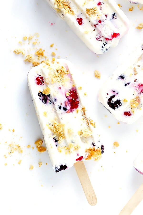 These Berry Cheesecake Popsicles are quick and easy to prep, they're chocked full of fresh berries and graham crackers, and they really do taste like cheesecake! | gimmesomeoven.com