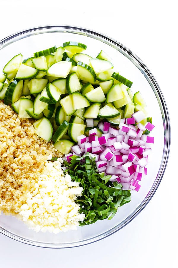 Love this Cucumber Quinoa Salad! It's super easy to make ahead of time, it's naturally gluten-free, and it's made with lots of fresh cucumber, feta, basil, red onion, and a simple lemon Italian vinaigrette. Perfect as a side or main dish! | gimmesomeoven.com