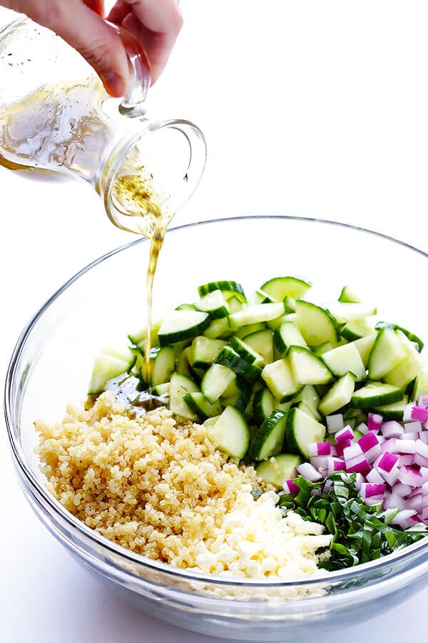 Love this Cucumber Quinoa Salad! It's super easy to make ahead of time, it's naturally gluten-free, and it's made with lots of fresh cucumber, feta, basil, red onion, and a simple lemon Italian vinaigrette. Perfect as a side or main dish! | gimmesomeoven.com