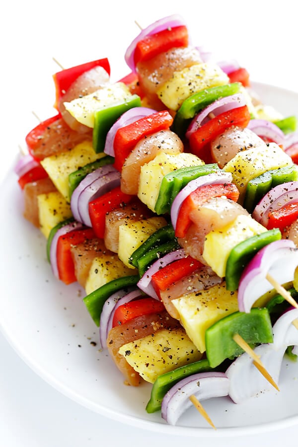 These Rainbow Hawaiian Chicken Kabobs are marinated and basted in a tasty teriyaki sauce, then grilled to perfection and sprinkled with cilantro. So delicious! | gimmesomeoven.com