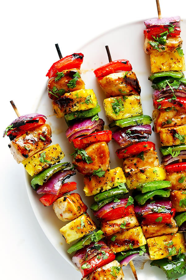 These Rainbow Hawaiian Chicken Kabobs are marinated and basted in a tasty teriyaki sauce, then grilled to perfection and sprinkled with cilantro. So delicious! | gimmesomeoven.com