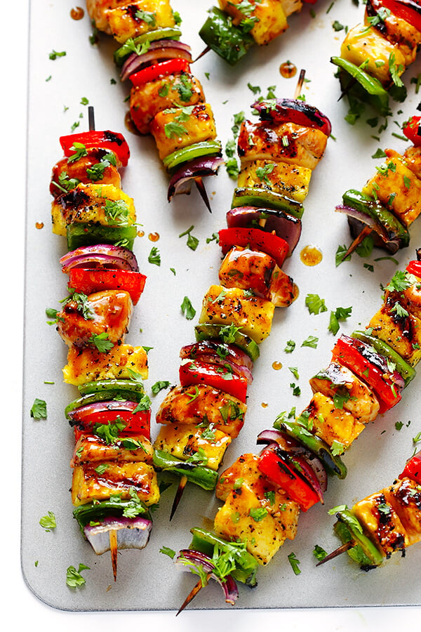 These Rainbow Hawaiian Chicken Kabobs are marinated and basted in a tasty teriyaki sauce, then grilled to perfection and sprinkled with cilantro. So delicious! | gimmesomeoven.com