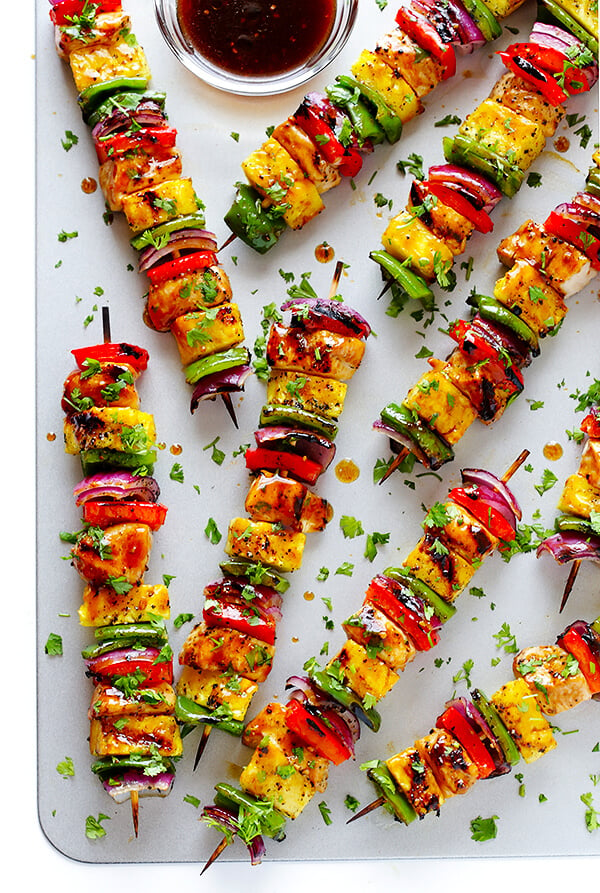 These Rainbow Hawaiian Chicken Kabobs are marinated and basted in a tasty teriyaki sauce, then grilled to perfection and sprinkled with cilantro. So delicious! | gimmesomeoven.com