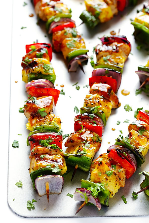 These Rainbow Hawaiian Chicken Kabobs are marinated and basted in a tasty teriyaki sauce, then grilled to perfection and sprinkled with cilantro. So delicious! | gimmesomeoven.com
