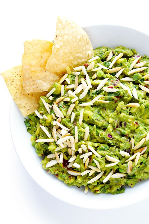This Toasted Almond and Chipotle Guacamole recipe is easy to make in about 10 minutes, and it's absolutely IRRESISTIBLE. Trust me. | gimmesomeoven.com (Vegan + Gluten Free)