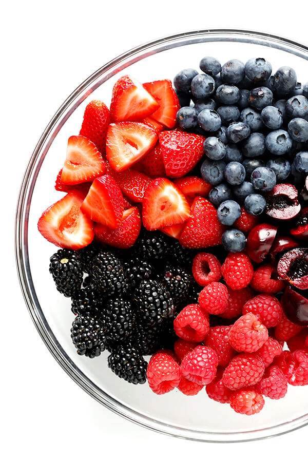 This Very Berry Fruit Salad recipe is a fantastic way to use up leftover fruit. Plus it just takes a few minutes to make, and tastes delicious with a hint of honey and fresh mint. | gimmesomeoven.com