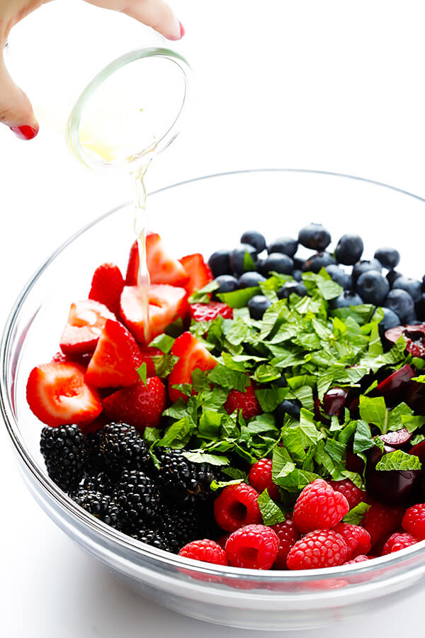 This Very Berry Fruit Salad recipe is a fantastic way to use up leftover fruit. Plus it just takes a few minutes to make, and tastes delicious with a hint of honey and fresh mint. | gimmesomeoven.com