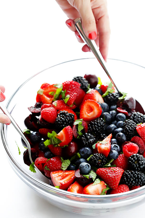 This Very Berry Fruit Salad recipe is a fantastic way to use up leftover fruit. Plus it just takes a few minutes to make, and tastes delicious with a hint of honey and fresh mint. | gimmesomeoven.com