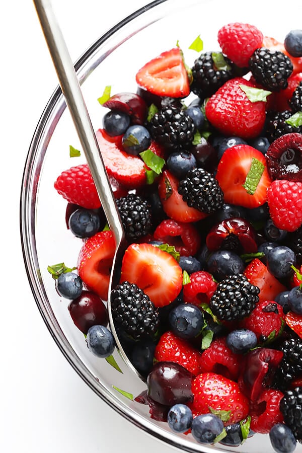 This Very Berry Fruit Salad recipe is a fantastic way to use up leftover fruit. Plus it just takes a few minutes to make, and tastes delicious with a hint of honey and fresh mint. | gimmesomeoven.com