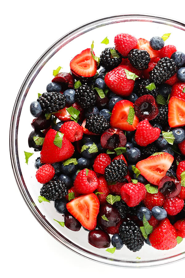 This Very Berry Fruit Salad recipe is a fantastic way to use up leftover fruit. Plus it just takes a few minutes to make, and tastes delicious with a hint of honey and fresh mint. | gimmesomeoven.com