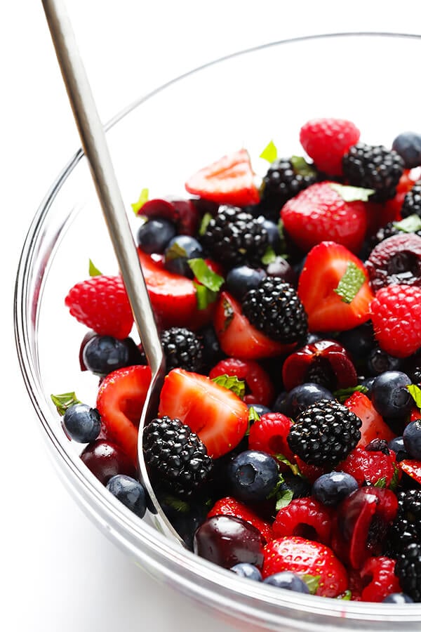 This Very Berry Fruit Salad recipe is a fantastic way to use up leftover fruit. Plus it just takes a few minutes to make, and tastes delicious with a hint of honey and fresh mint. | gimmesomeoven.com
