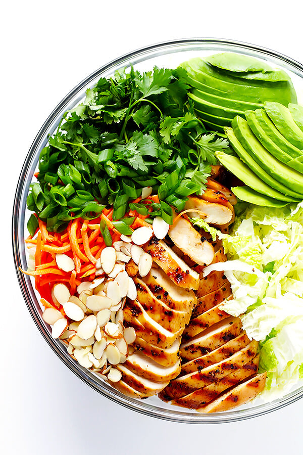 This Asian Chicken Chopped Salad recipe is quick and easy to make, packed with fresh ingredients and zesty chicken, and tossed with a heavenly creamy sesame ginger vinaigrette. So delicious!! | gimmesomeoven.com