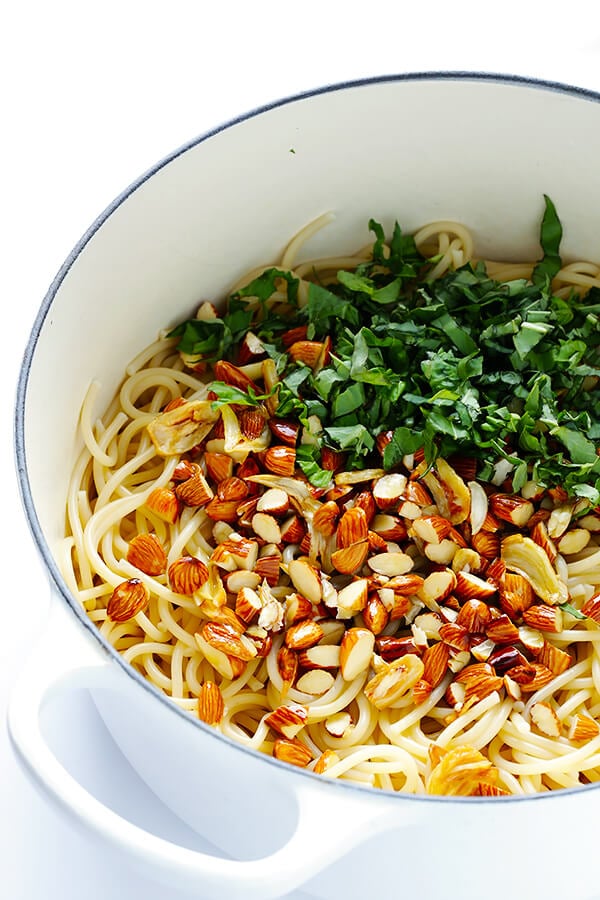 Lemon Basil Spaghetti with Almonds -- quick and easy to make, full of zesty garlic lemon flavor, and topped with a sprinkle of Parmesan. So delicious! | gimmesomeoven.com