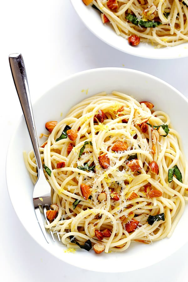 Lemon Basil Spaghetti with Almonds -- quick and easy to make, full of zesty garlic lemon flavor, and topped with a sprinkle of Parmesan. So delicious! | gimmesomeoven.com