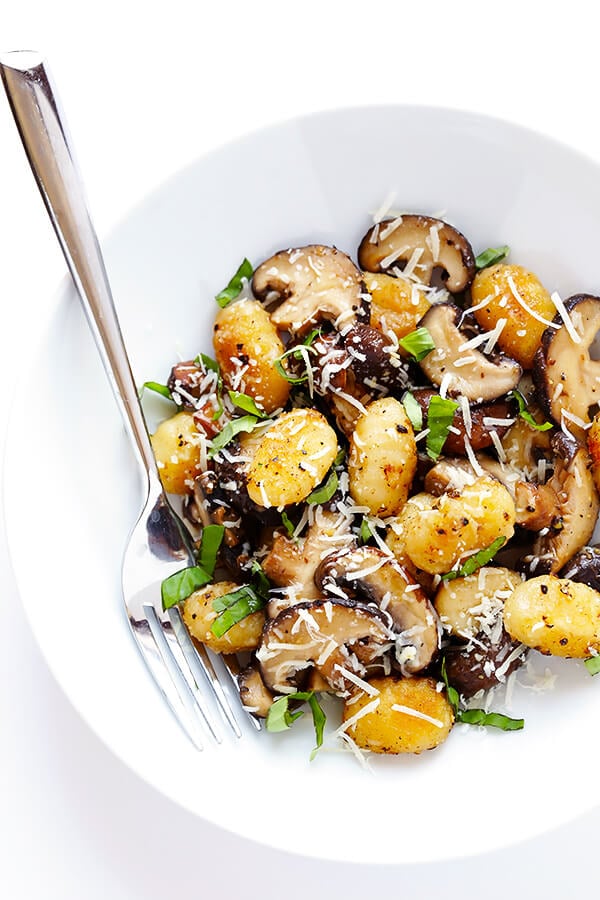 This Toasted Gnocchi with Mushrooms, Basil and Parmesan recipe only takes about 30 minutes to prepare, it's nice and hearty, and full of absolutely delicious flavors! | gimmesomeoven.com (Gluten-Free / Vegetarian)