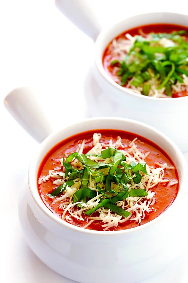 This 20-Minute Tomato Soup recipe is quick and easy to make, made with lots of fresh basil and garlic, and absolutely delicious! | gimmesomeoven.com (Vegan / Vegetarian / Gluten-Free)