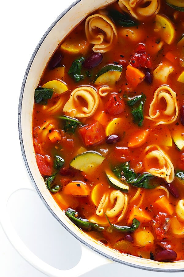 This Tortellini Minestrone recipe is overflowing with delicious veggies, and made extra-delicious with the addition of some cheesy tortellini. | gimmesomeoven.com