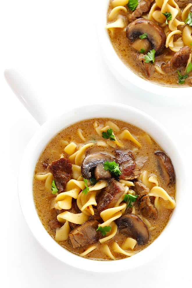 This Beef Stroganoff Soup recipe is easy to make, full of tender beef and noodles, and an absolutely delicious dinner! | gimmesomeoven.com