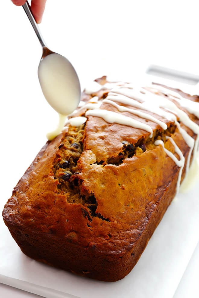 This Cranberry Orange Banana Bread recipe is easy to make, drizzled with a yummy orange glaze, and perfectly moist and delicious! | gimmesomeoven.com