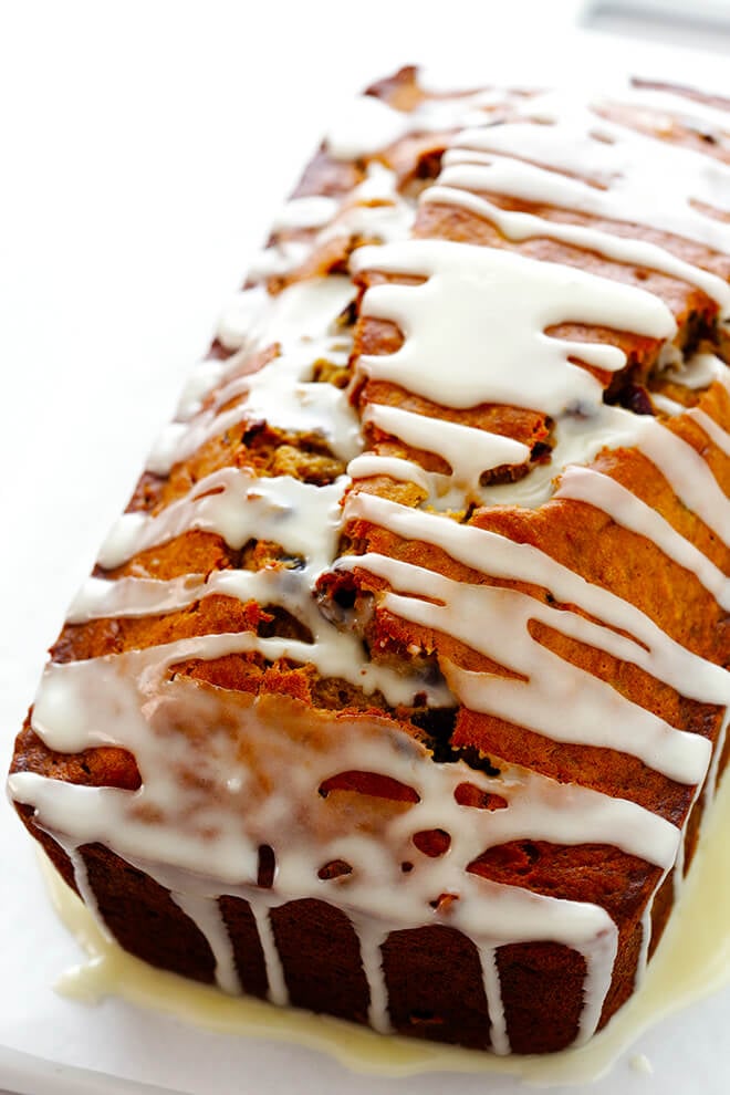 This Cranberry Orange Banana Bread recipe is easy to make, drizzled with a yummy orange glaze, and perfectly moist and delicious! | gimmesomeoven.com