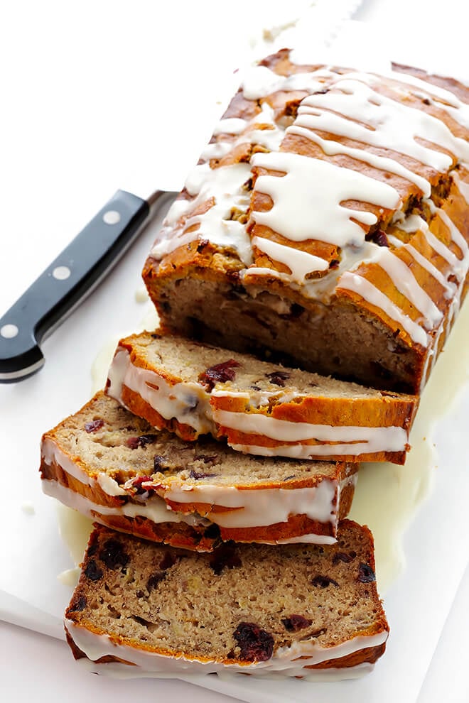 This Cranberry Orange Banana Bread recipe is easy to make, drizzled with a yummy orange glaze, and perfectly moist and delicious! | gimmesomeoven.com