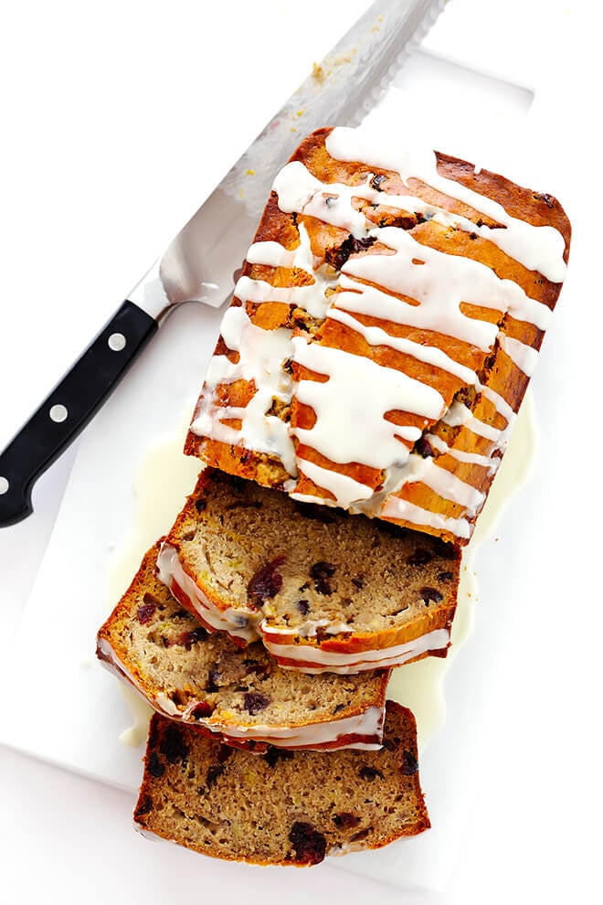 This Cranberry Orange Banana Bread recipe is easy to make, drizzled with a yummy orange glaze, and perfectly moist and delicious! | gimmesomeoven.com