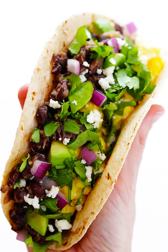 These easy Black Bean Breakfast Tacos are made with a zesty black bean filling, and you can top them with whatever you'd like! | gimmesomeoven.com