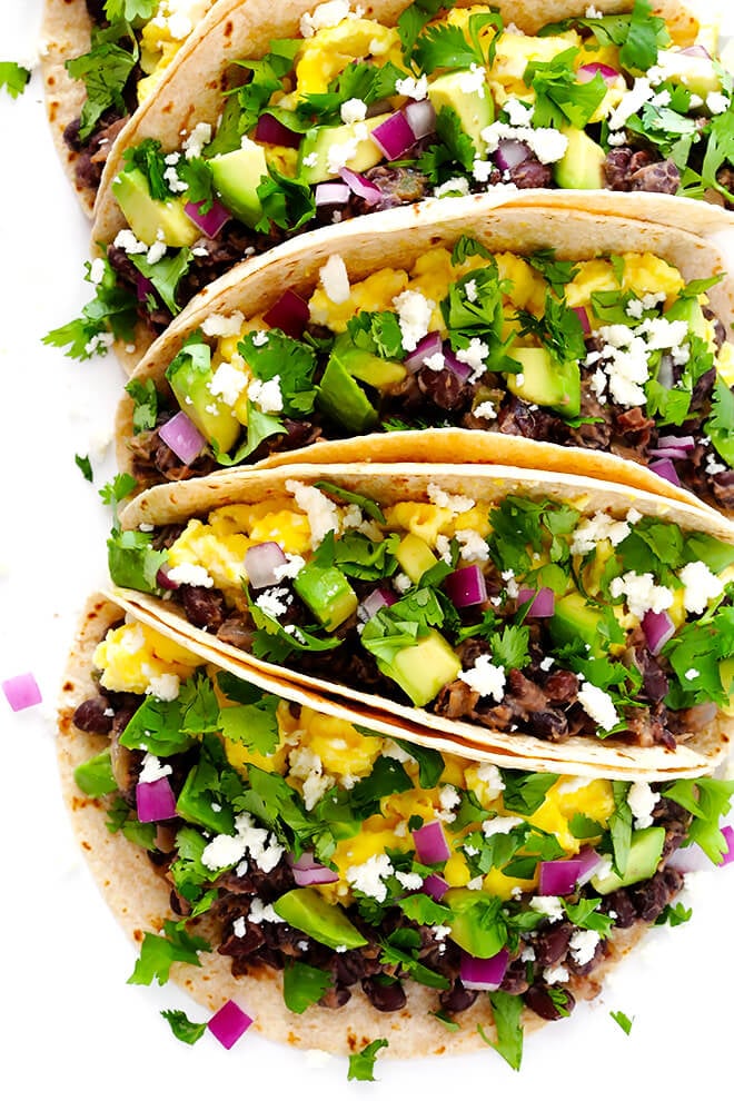 These easy Black Bean Breakfast Tacos are made with a zesty black bean filling, and you can top them with whatever you'd like! | gimmesomeoven.com