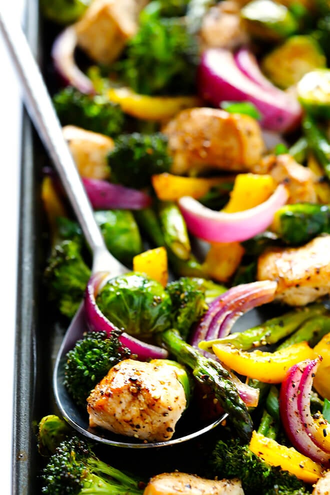 This delicious Sheet Pan Chicken and Veggies "Stir Fry" dinner recipe is quick and easy to prepare, and made with a delicious sesame-soy dressing that everyone will love. Plus, it's easy to make-ahead and refrigerate if you'd like to do some meal planning for the week! | gimmesomeoven.com