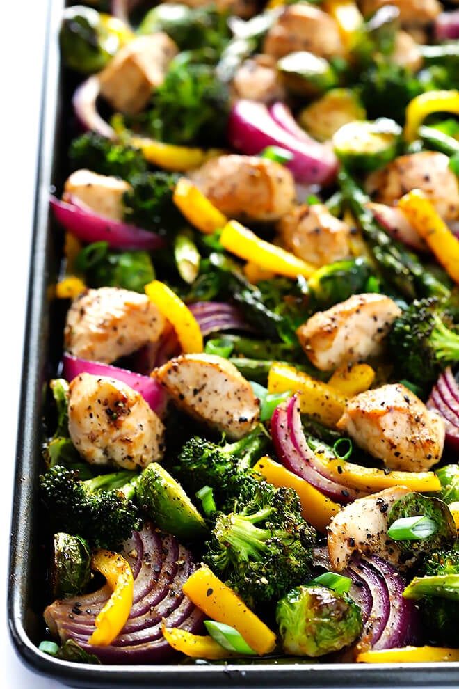 This delicious Sheet Pan Chicken and Veggies "Stir Fry" dinner recipe is quick and easy to prepare, and made with a delicious sesame-soy dressing that everyone will love. Plus, it's easy to make-ahead and refrigerate if you'd like to do some meal planning for the week! | gimmesomeoven.com