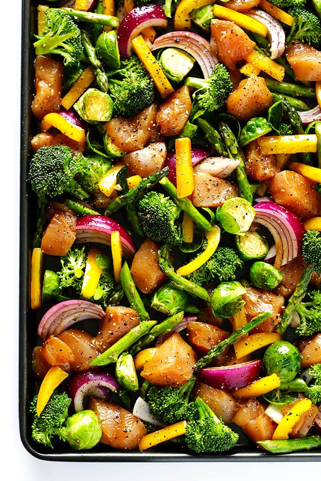 This delicious Sheet Pan Chicken and Veggies "Stir Fry" dinner recipe is quick and easy to prepare, and made with a delicious sesame-soy dressing that everyone will love. Plus, it's easy to make-ahead and refrigerate if you'd like to do some meal planning for the week! | gimmesomeoven.com