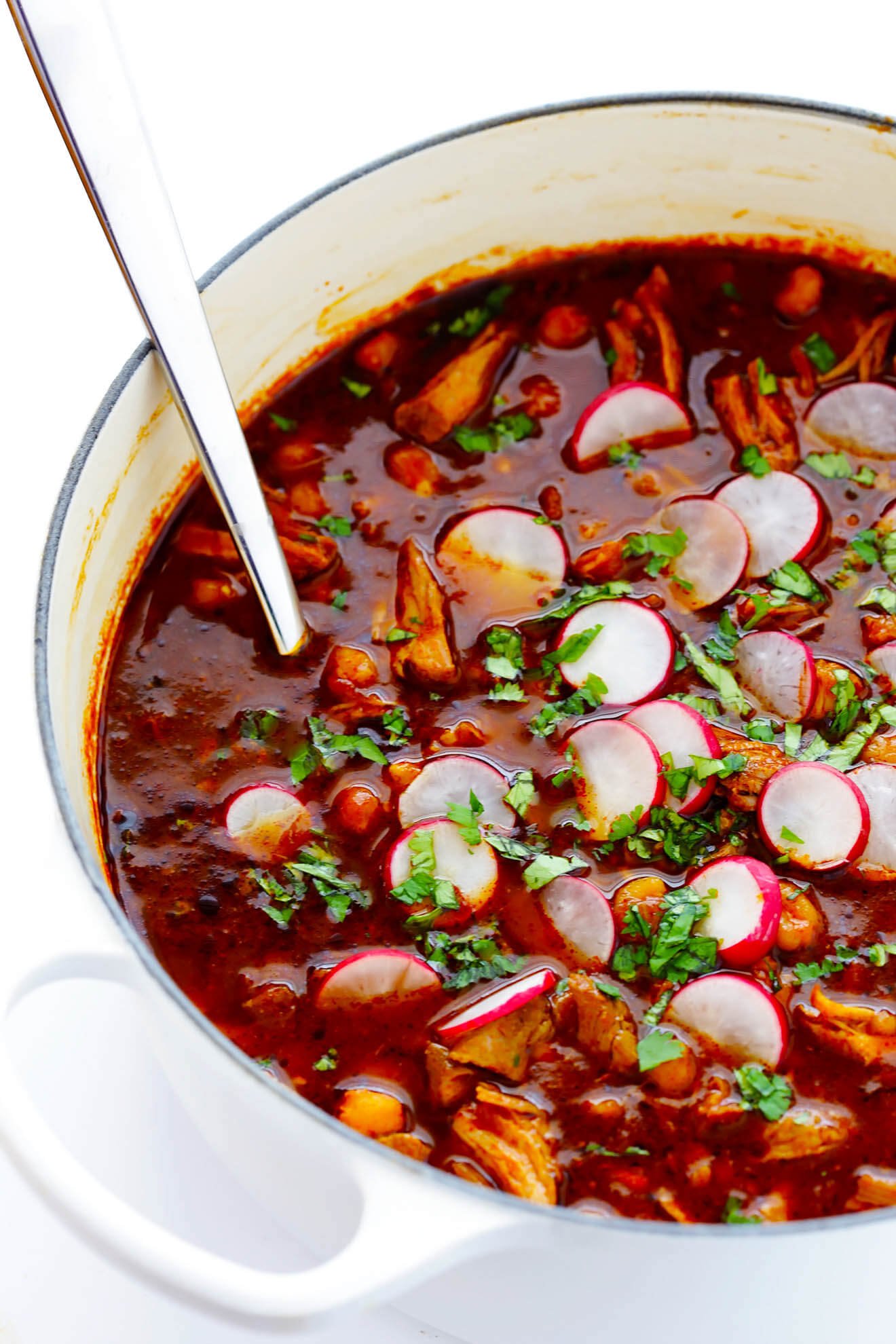 This Posole Rojo recipe is a delicious Mexican pork stew, slow simmered with the most amazing chiles. | gimmesomeoven.com