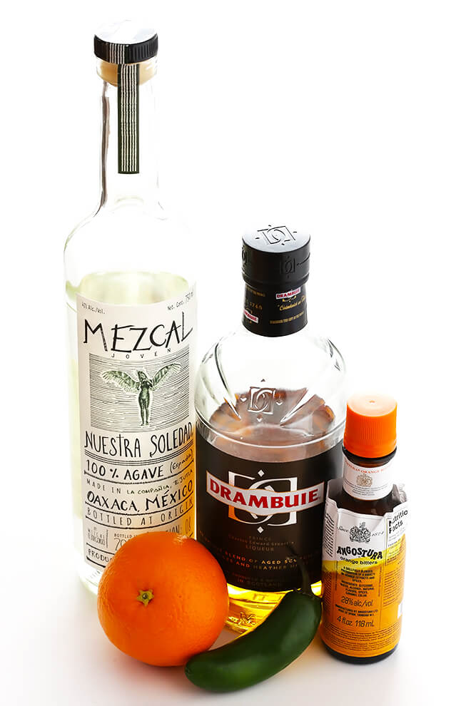 This easy cocktail is made with mezcal, Drambuie, orange bitters, jalapeno, and orange peel. The perfect blend of smoky, spicy, citrusy, and slightly-sweet -- so good!! | gimmesomeoven.com