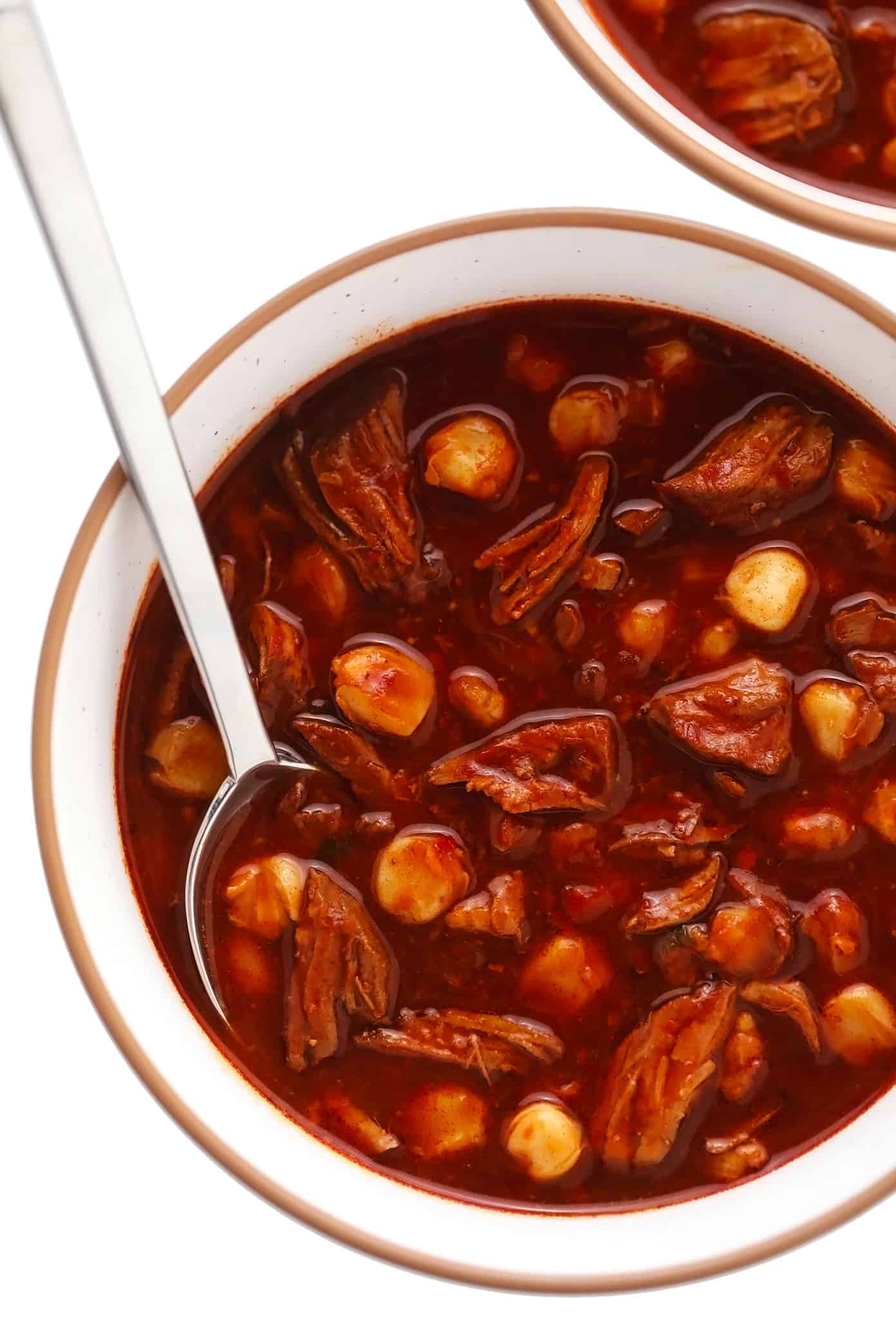 Serving bowl of red pozole without toppings