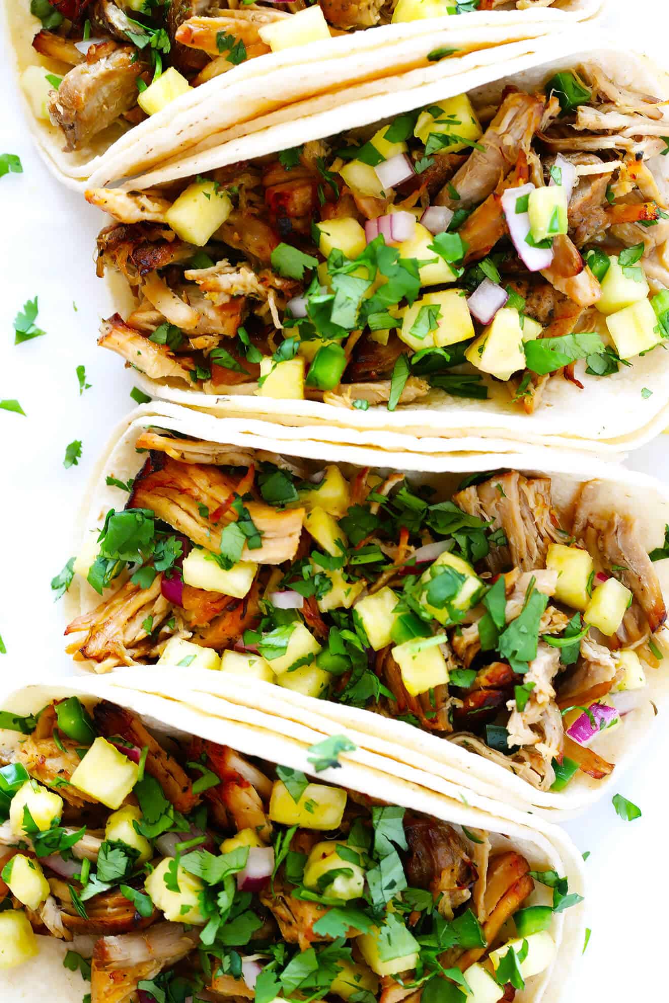 These delicious Instant Pot Carnitas Tacos are easy to make, and sprinkled with a yummy pineapple salsa. | gimmesomeoven.com