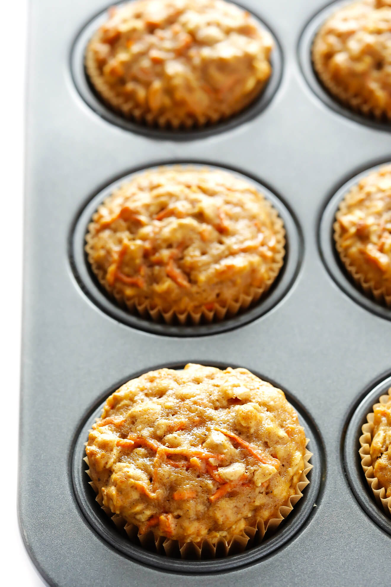 These Wholesome Carrot Muffins are easy to make, naturally sweetened with honey, and perfectly moist and delicious! | gimmesomeoven.com