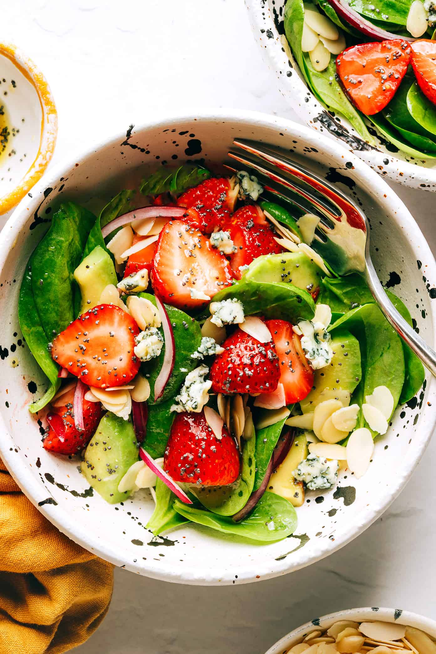 Strawberry Spinach Salad in Bowl with Poppyseed Dressing