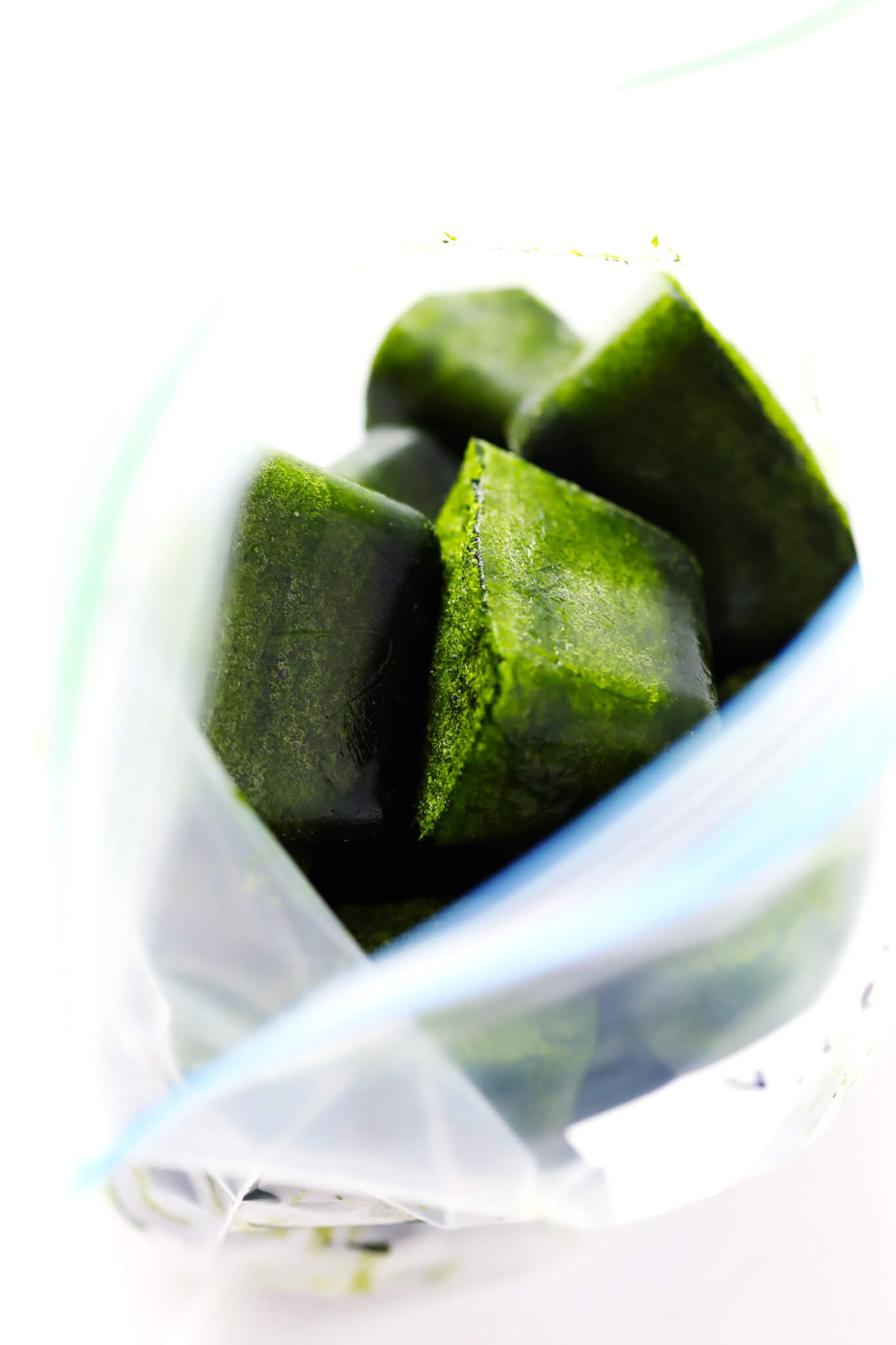 This Frozen Spinach Cubes recipe is a lifesaver! Just puree some spinach and coconut water, freeze, and add to green smoothies whenever you'd like! | gimmesomeoven.com