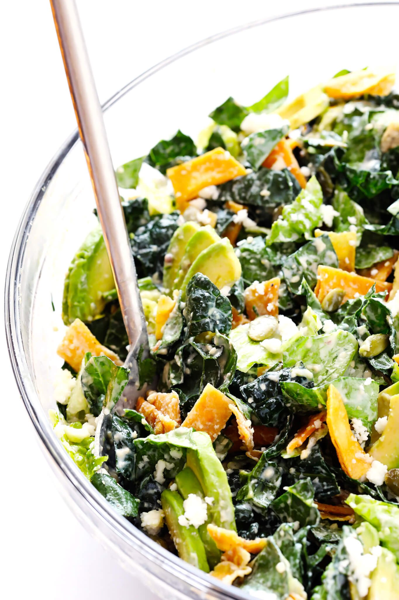 LOVE this Mexican Caesar Salad! It's made with lots of avocado, crispy tortilla strips, pepitas, zesty cotija cheese, fresh lime juice, and a creamy Greek Yogurt Caesar Dressing that is AMAZING. Such a great recipe!! | gimmesomeoven.com