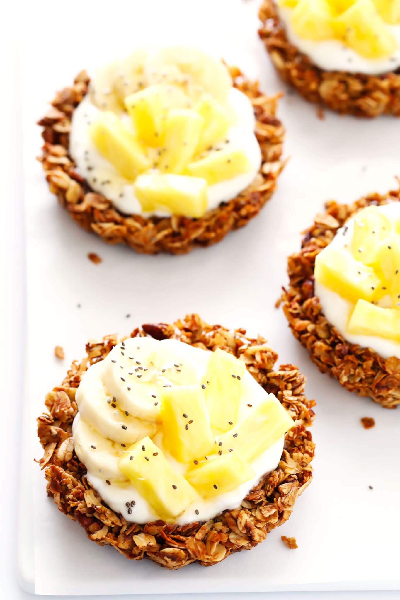 These Mini Granola Tart Cups are a cute and delicious way to serve your granola! Fill them with yogurt and fruit for breakfast, no-bake fillings for dessert, or whatever sounds good. | gimmesomeoven.com (Gluten-Free / Vegetarian)