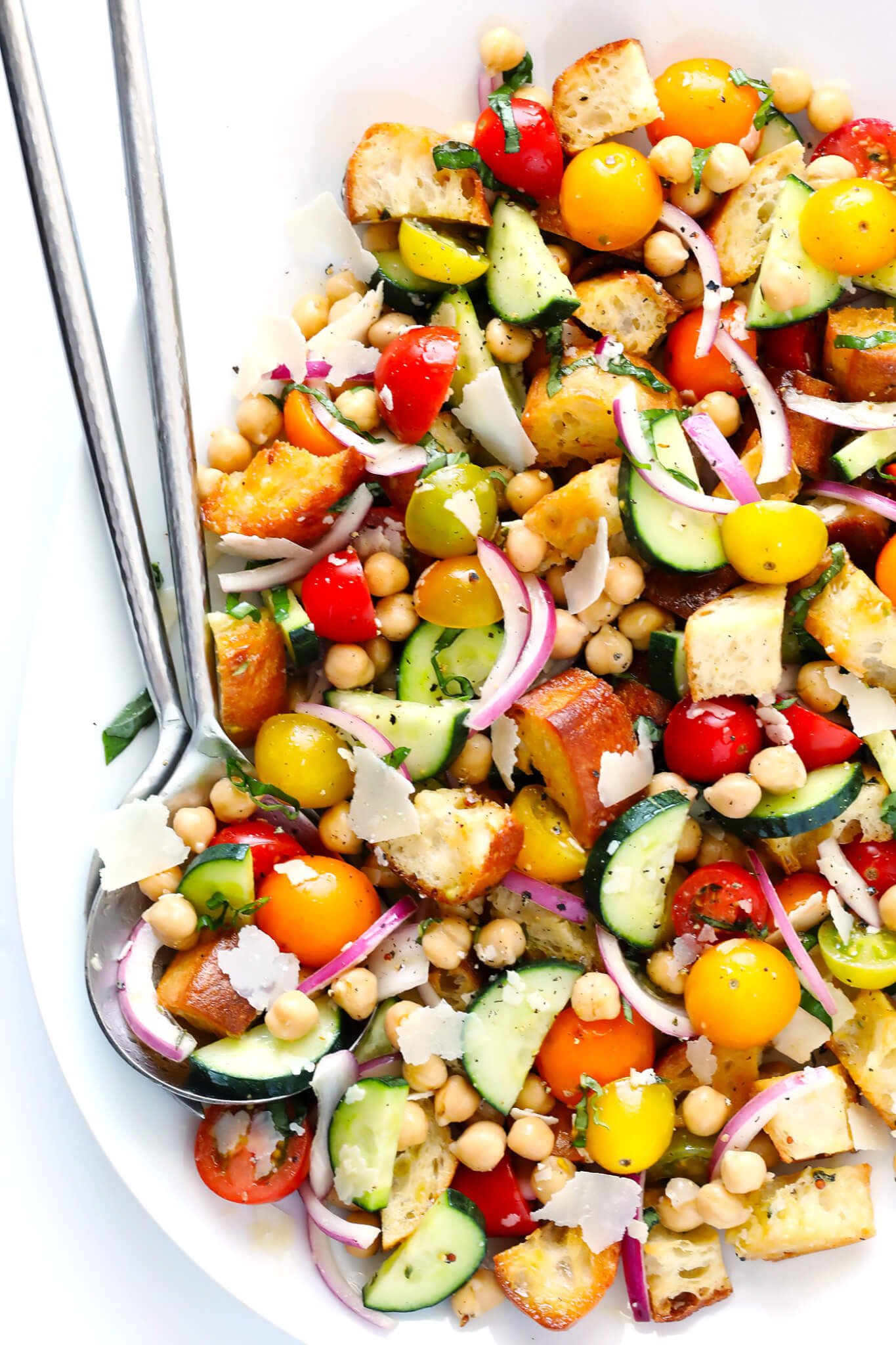 LOVE this easy panzanella recipe! It's full of cherry tomatoes, veggies, toasted buttery bread, chickpeas, basil, and tossed in a delicious Italian vinaigrette. Perfect for summertime! | gimmesomeoven.com (Vegetarian)
