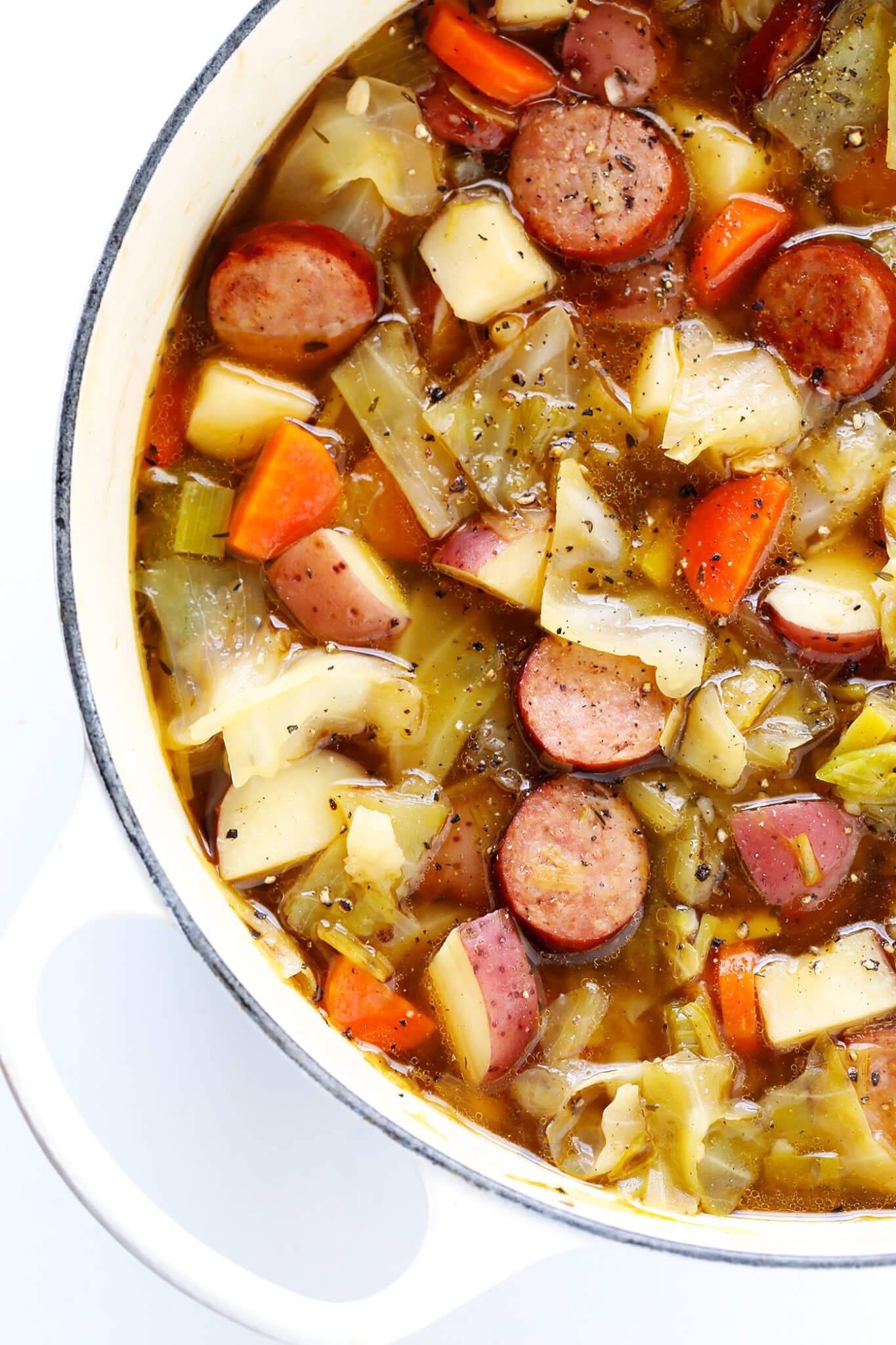 This Cabbage, Sausage and Potato Soup recipe is hearty and comforting, easy to make, and so savory and delicious. My kind of cabbage soup! | Gimme Some Oven #glutenfree #cabbage #soup #recipe