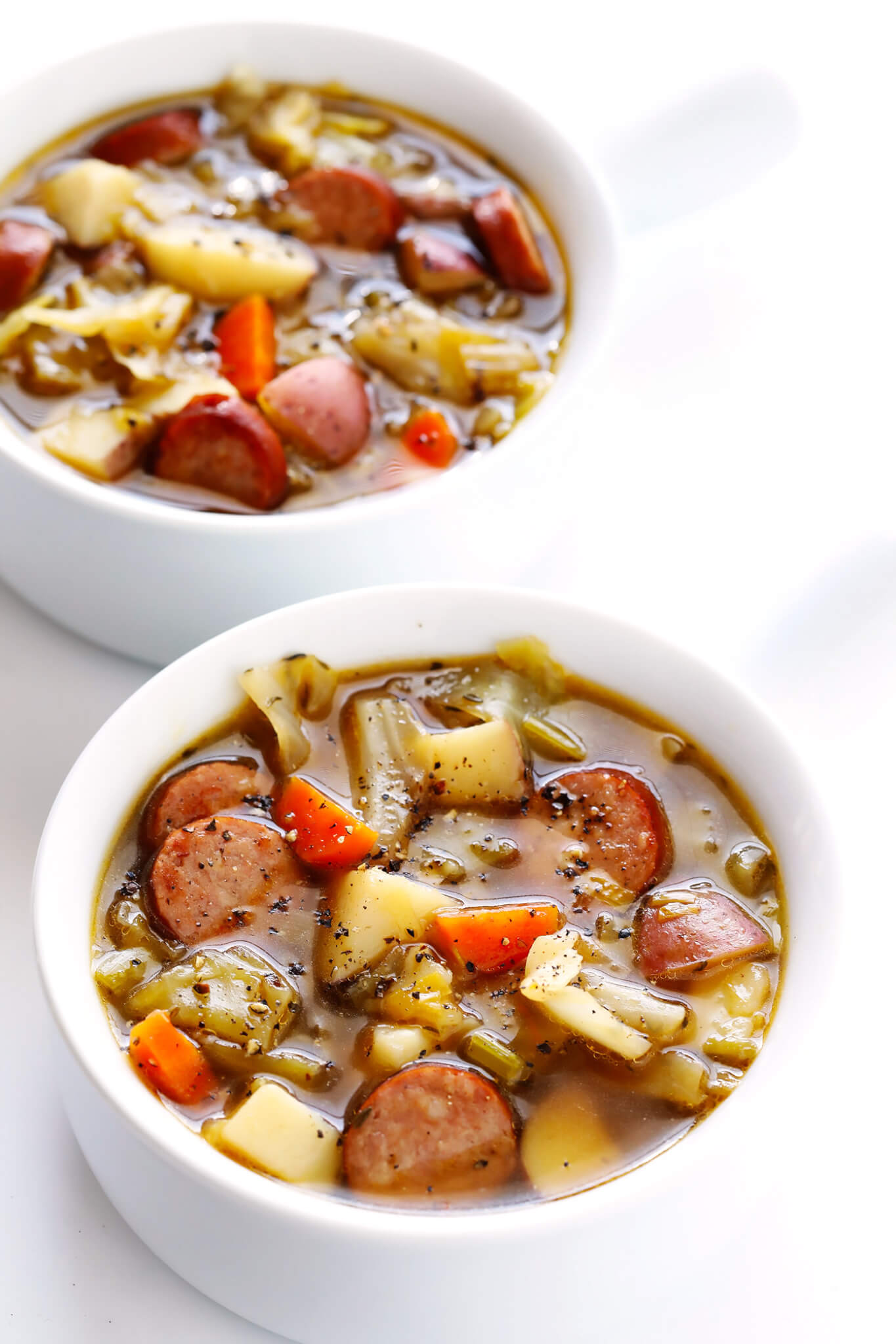 This Cabbage, Sausage and Potato Soup recipe is hearty and comforting, easy to make, and so savory and delicious. My kind of cabbage soup! | gimmesomeoven.com (Gluten-Free / Dairy-Free)