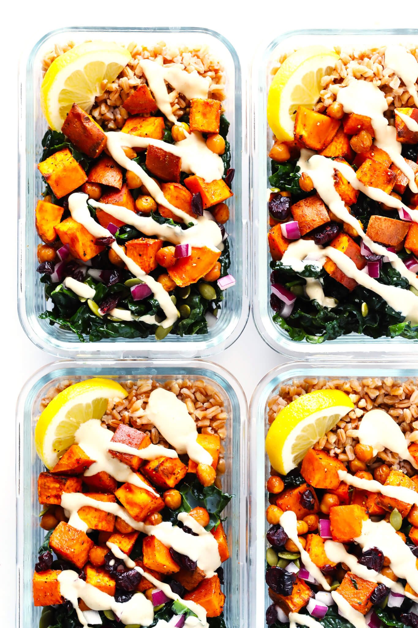 LOVE these meal prep kale salad bowls! They're filled with roasted sweet potatoes, zesty chickpeas, tender kale, pepitas (pumpkin seeds), cranberries, red onions, and a dreamy lemon-tahini dressing. Feel free to add quinoa or farro or rice if you'd like too! | Gluten-Free, Vegetarian, Vegan | Gimme Some Oven