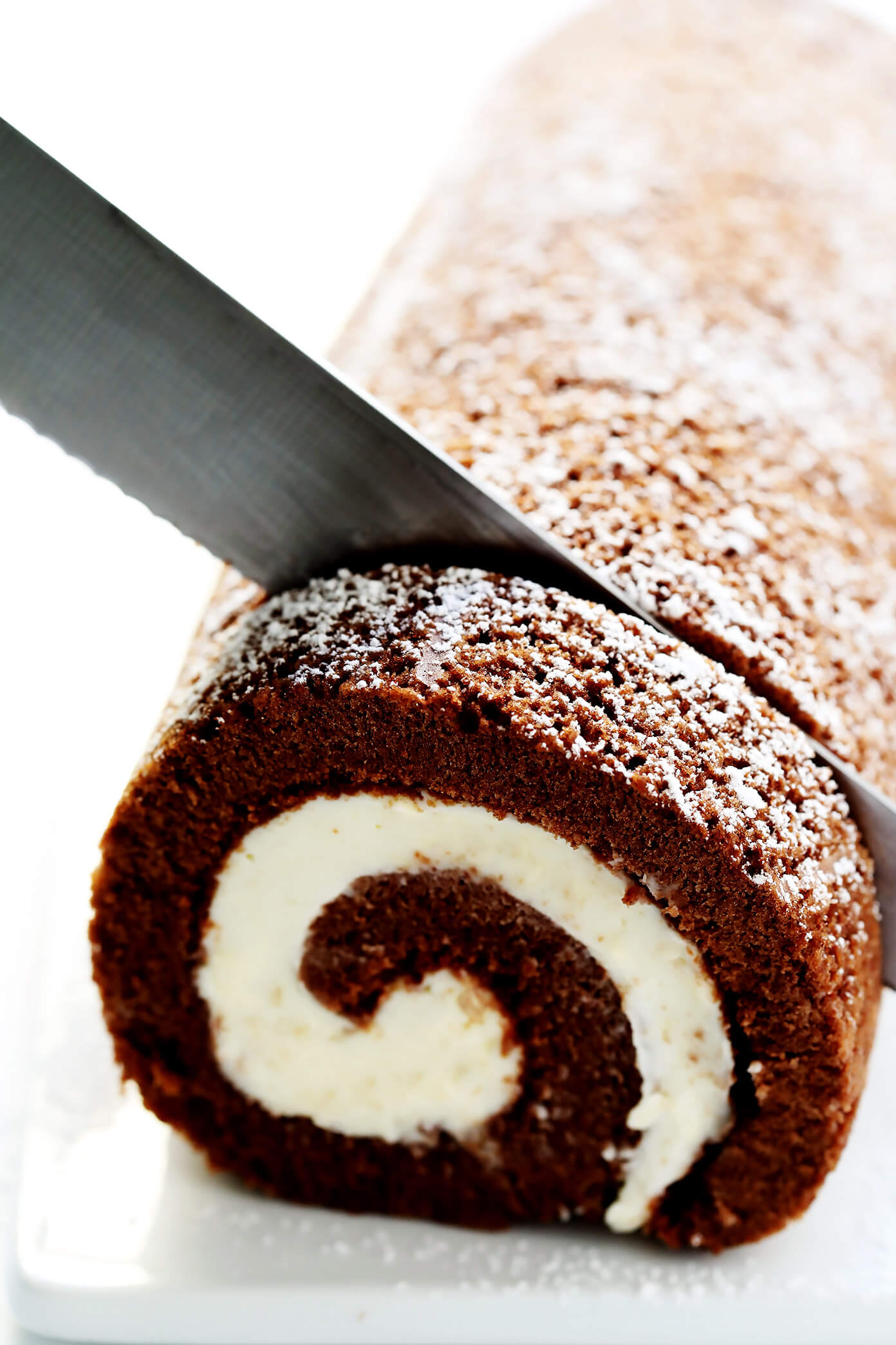 This amazing Chocolate Roll Recipe (a.k.a. "Chocolate Swiss Roll") is easy to customize with your favorite fillings (cream cheese is my fave!). Plus, it's also easy to make ahead and freeze. Perfect for holiday entertaining, and even giving away as gifts! | Gimme Some Oven #chocolate #cake #christmas #dessert