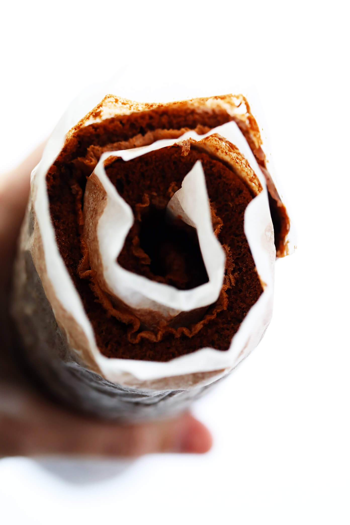 This amazing Chocolate Roll Recipe (a.k.a. "Chocolate Swiss Roll") is easy to customize with your favorite fillings (cream cheese is my fave!). Plus, it's also easy to make ahead and freeze. Perfect for holiday entertaining, and even giving away as gifts! | Gimme Some Oven #chocolate #cake #christmas #dessert