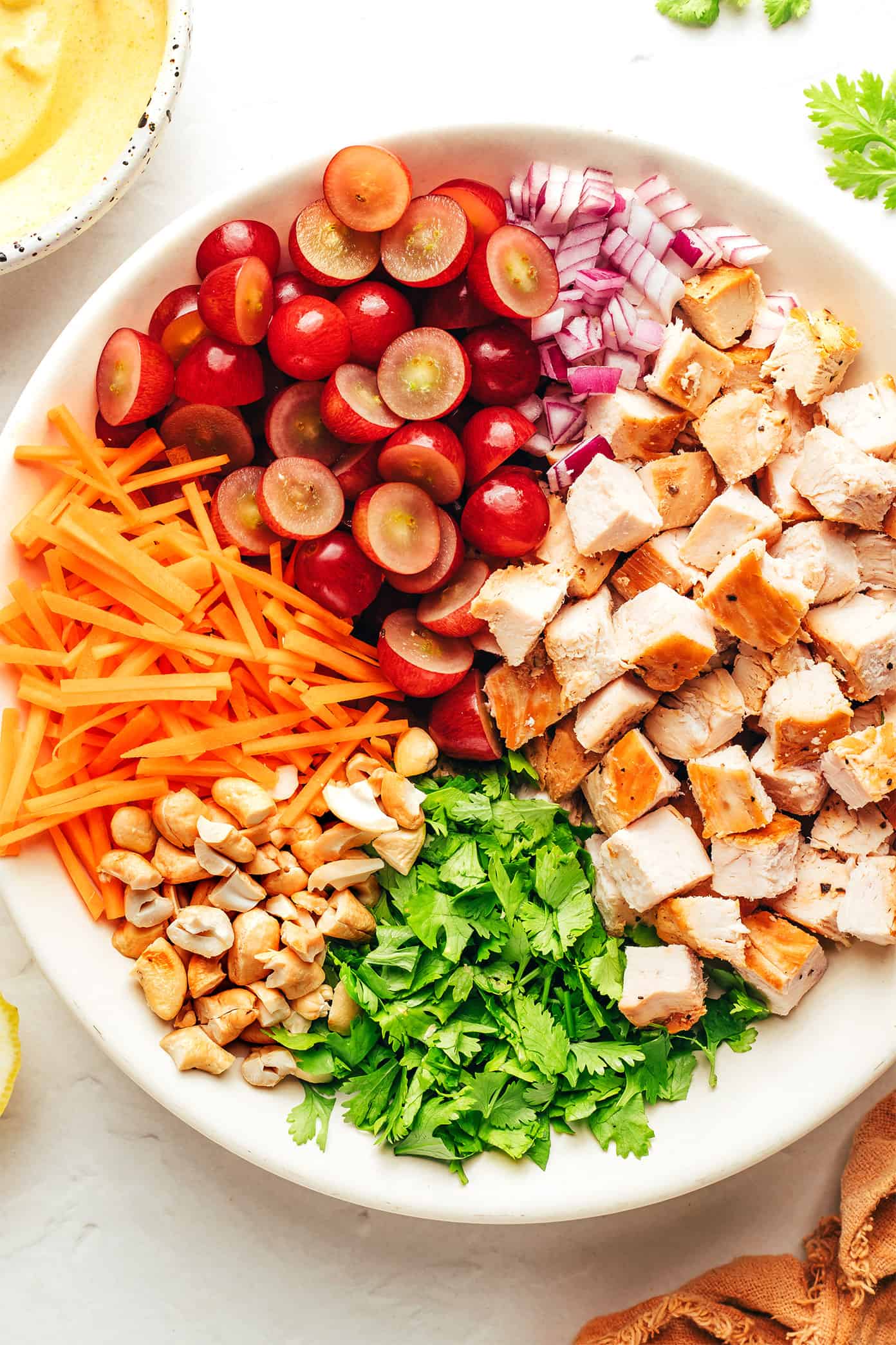 Curry chicken salad ingredients in bowl
