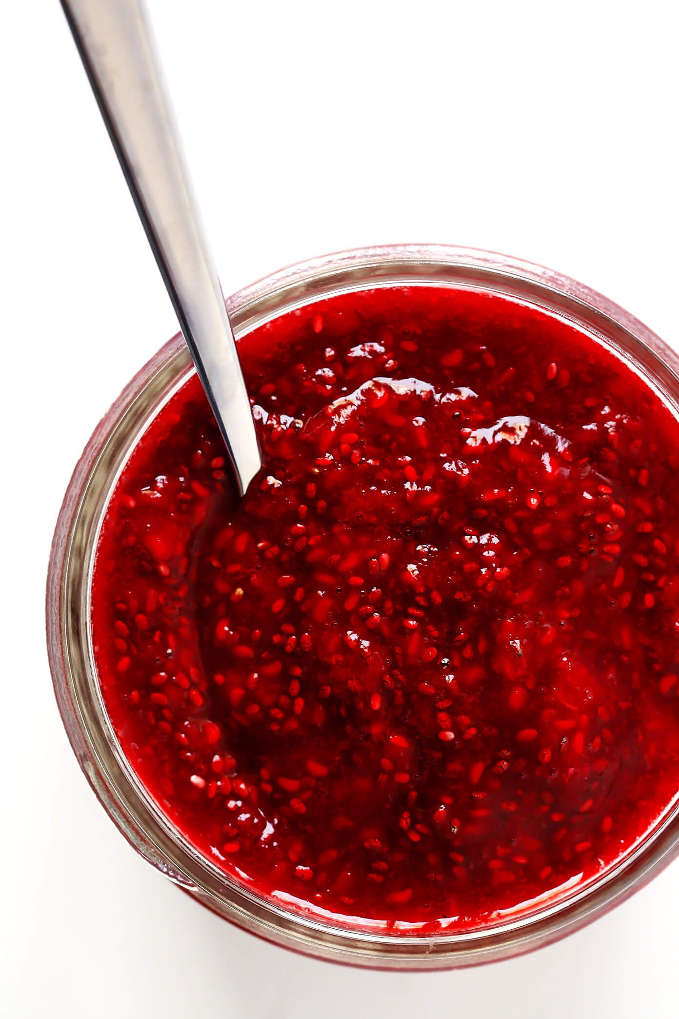 This 10-Minute Chia Seed Jam recipe is super easy to make, it's made with just 1 tablespoon of honey (instead of tons of added sugars!), it's perfect for breakfasts (toast, parfaits, etc.), sandwiches, cookies, and more, and it's SO delicious! Feel free to make it with your favorite juicy fruit (such as strawberry, blackberry, raspberry, peach, etc.). | Gimme Some Oven #chiajam #cleaneating #chiaseed #healthybreakfast