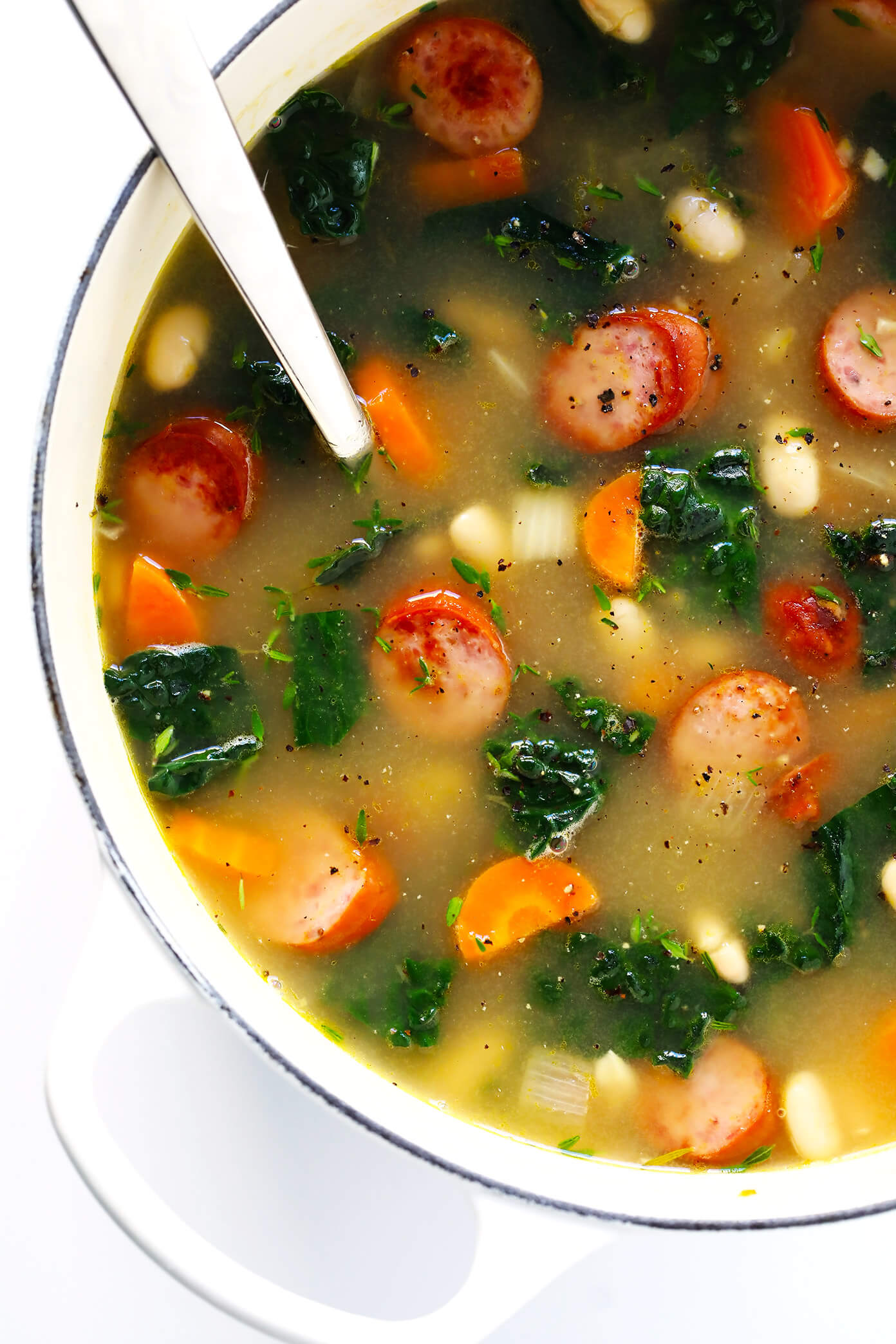 This Tuscan White Beans, Sausage and Kale Soup is one of my favorite winter dinner recipes. It's easy to make, full of cozy Italian flavors, and it's so warm and comforting. | Gimme Some Oven #souprecipe #healthysoup #italianrecipes