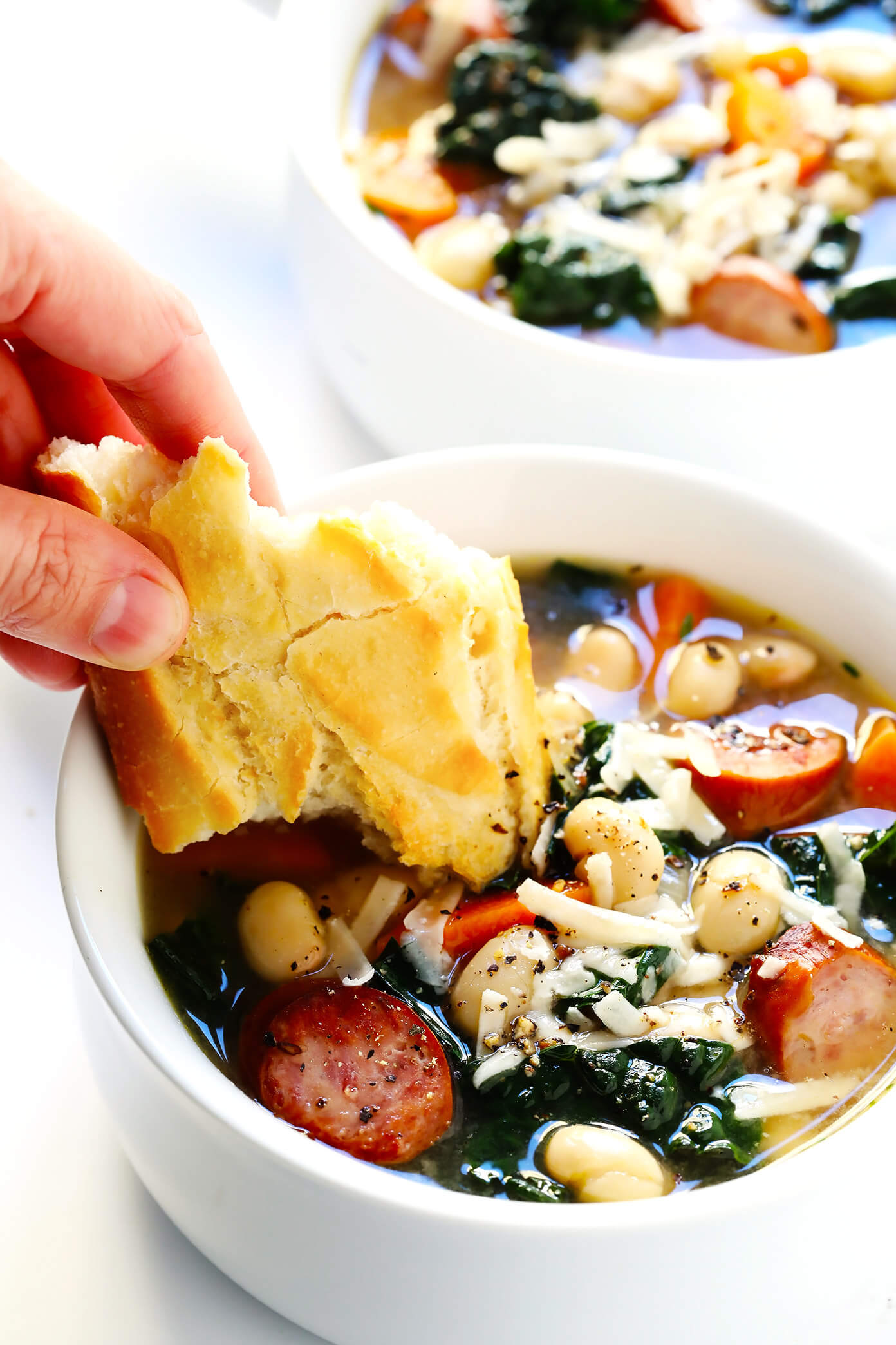 This Tuscan White Beans, Sausage and Kale Soup is one of my favorite winter dinner recipes. It's easy to make, full of cozy Italian flavors, and it's so warm and comforting. | Gimme Some Oven #souprecipe #healthysoup #italianrecipes